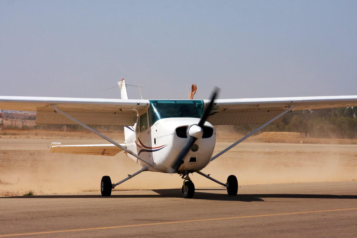 Airplane parked on an unimproved strip