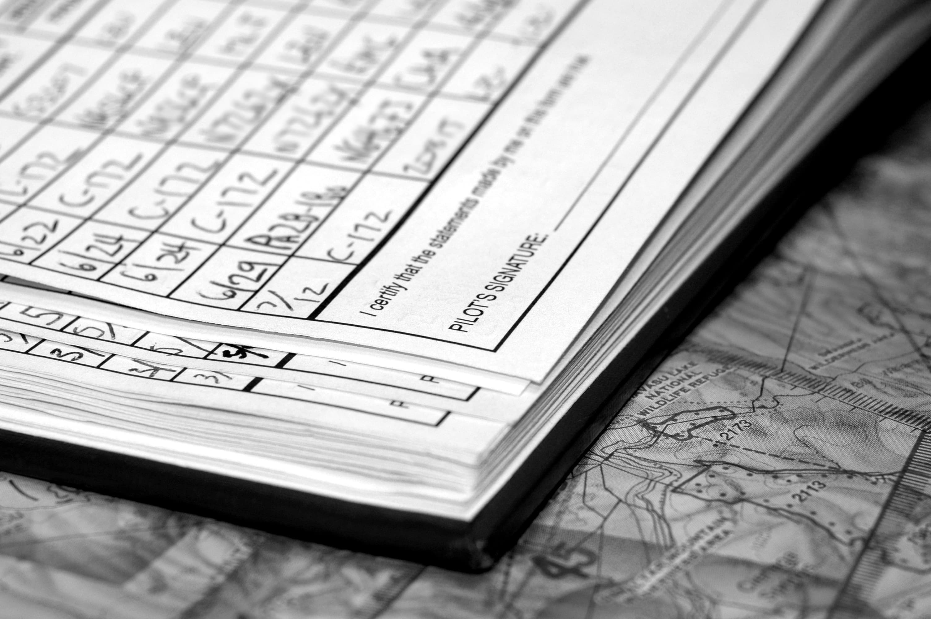 Pilot logbook on a sectional chart